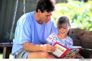 father-reading-to-daughter