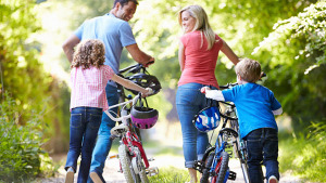 family-pushing-bikes-rear-view