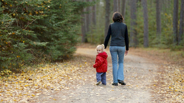 life-insurance-woman-walking-with-child